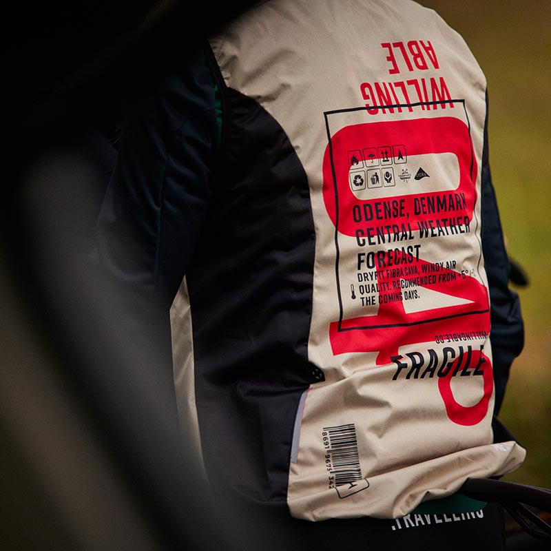 Photo of a shirt seen from the back, written on it is the cyclin apparel name Willing Able.