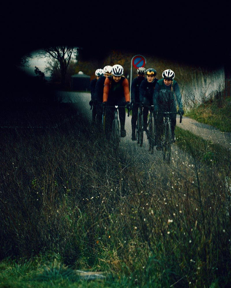 Female cyclists cycling on a road.