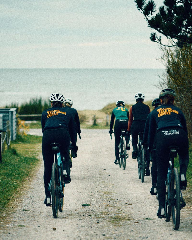 Female cyclists in the all women community of WeCycling. Cycling towards the water.