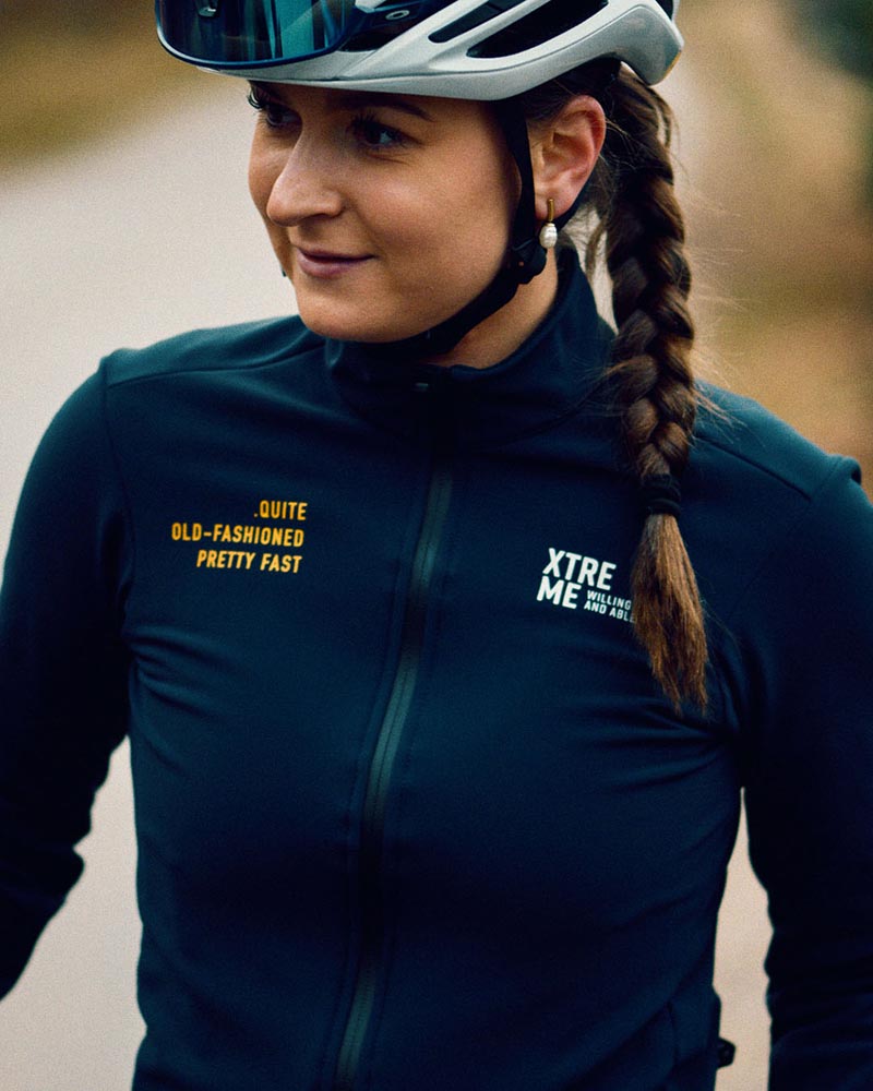 One of the founders of WeCycing standing for a photo with cycling apparel on.