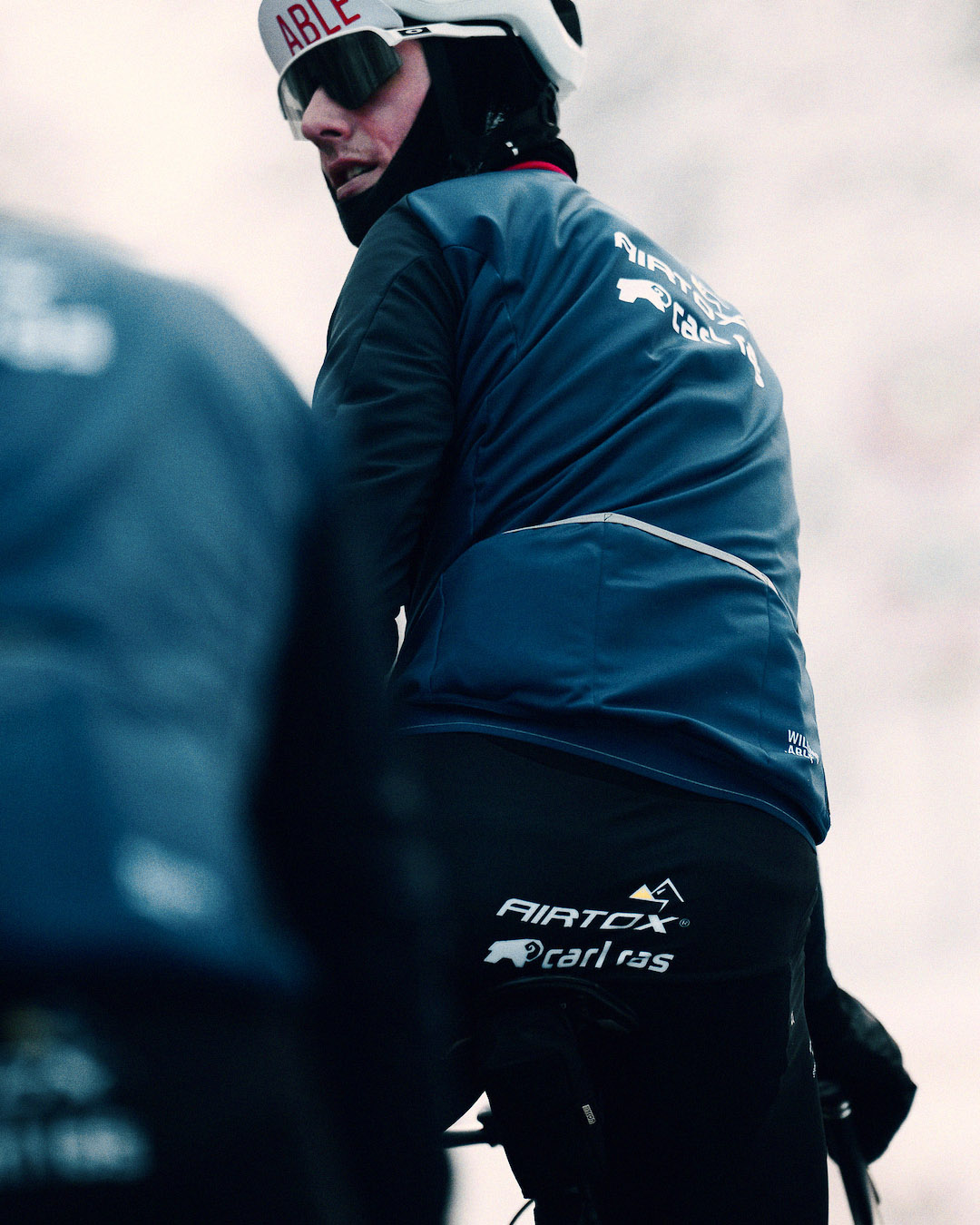 A member of Team Airtox looking back from his bike.