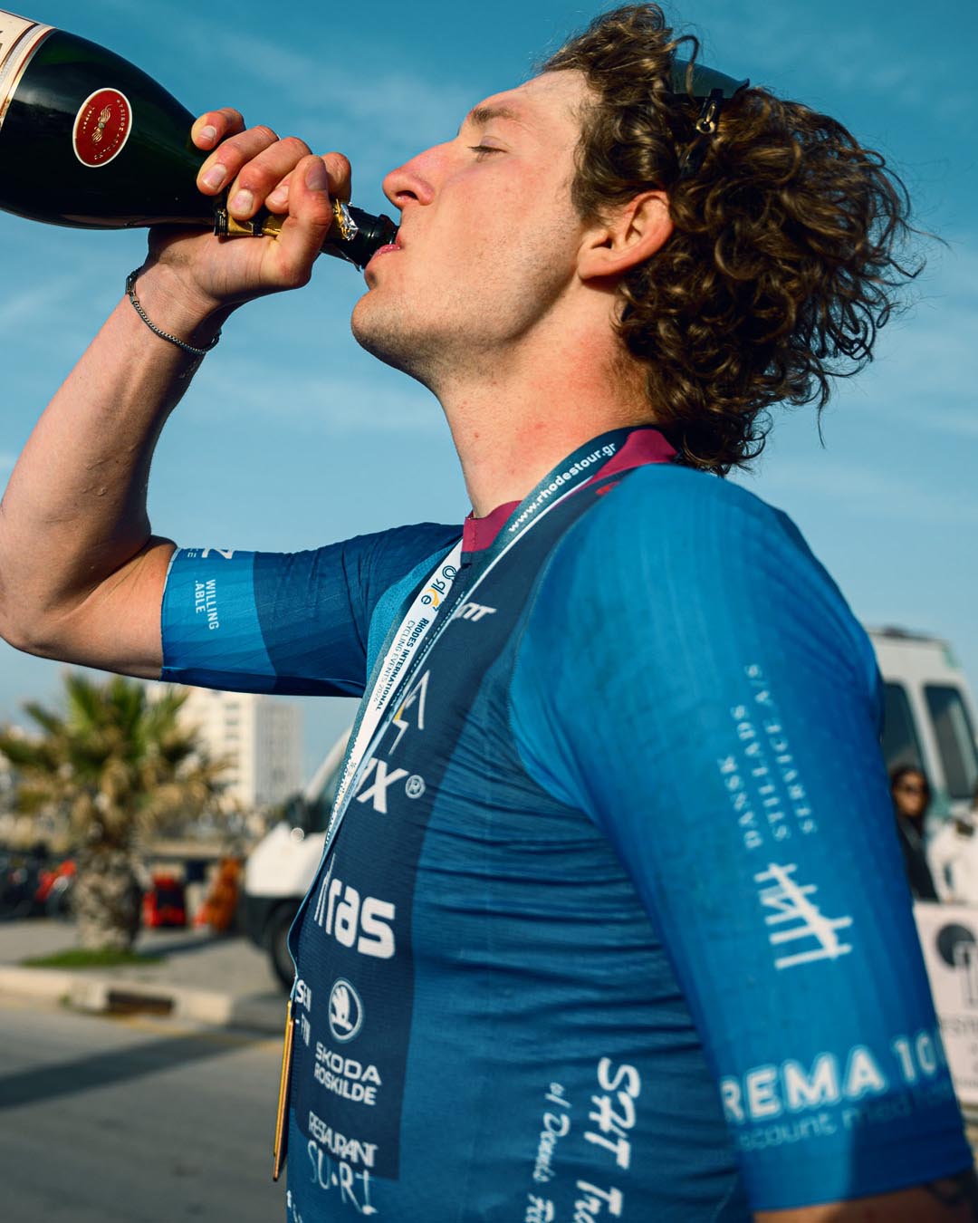 Team Airtox Carl Ras rider drinking champagne after the run in Rhodes.