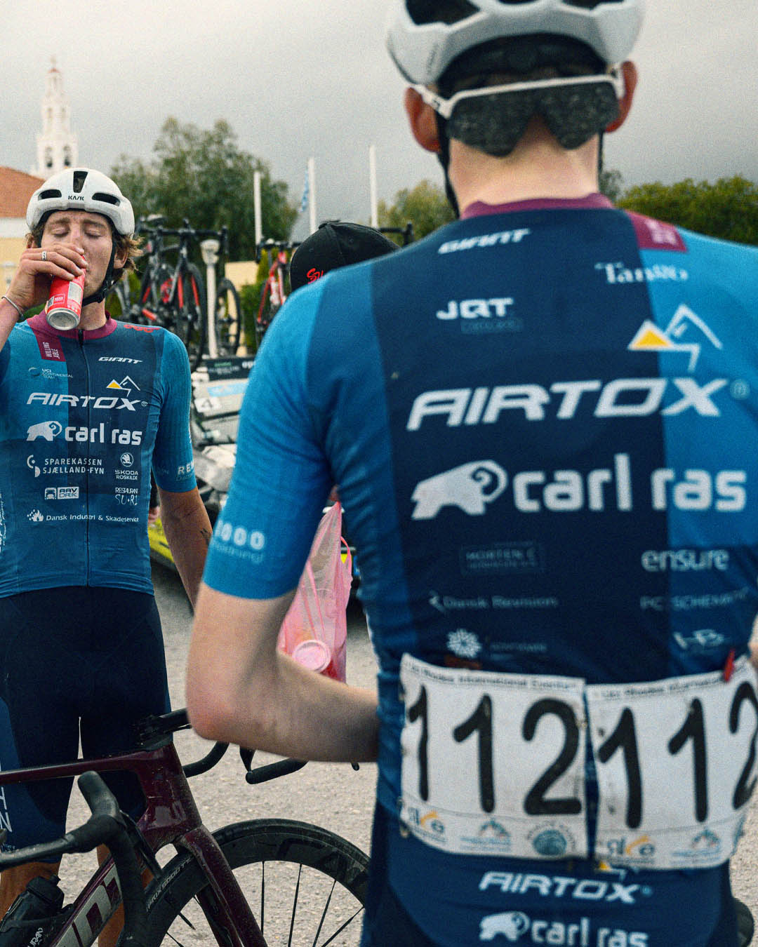 A photo of two cyclists wearing a blue performance shirt made by Willing Able.