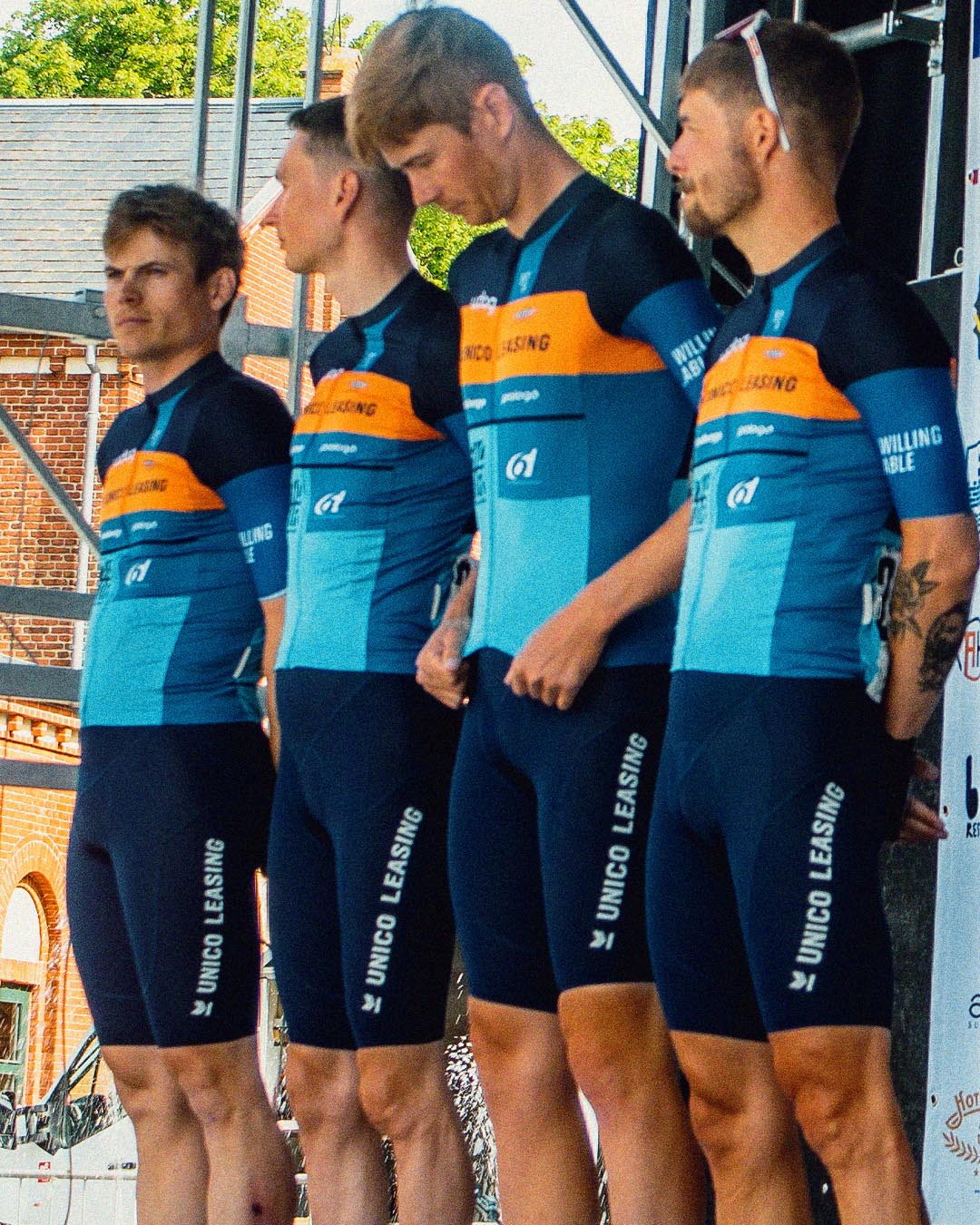 4 Willing Able cyclists stadning on the podium at Grand Prix Herning.