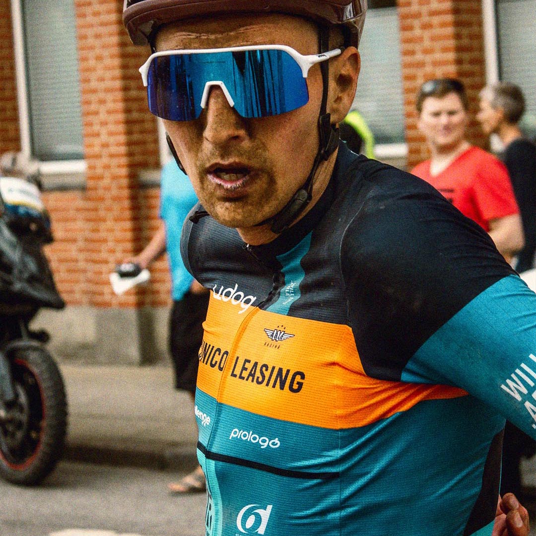 Cyclist from Willing Able looking at camera with dirt on his face. Picture taken for the sports news in week 22