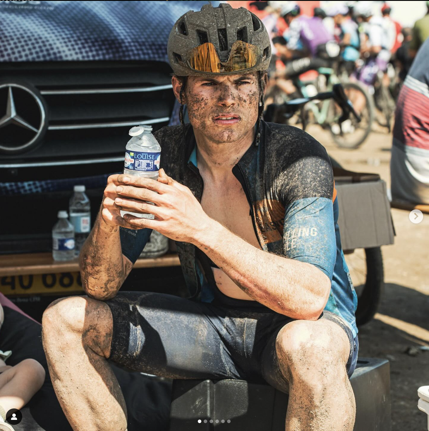 Photo taken of the Willing Able cyclist Jonas Lindberg after the race drinking water sitting in the shadow.