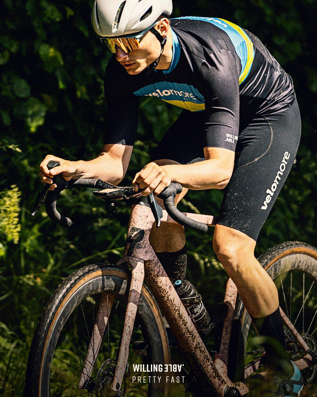 Single cyclist wearing the apparel brand Willing Able.
