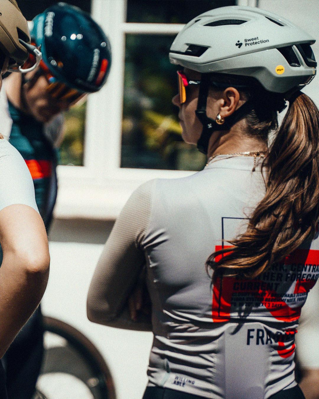 Cyclist wearing a helmet and a WA t-shirt