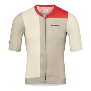 The Sandy SS Jersey offers a race-fit design, breathable mesh, and eco-friendly materials for comfort and performance in warm weather. Colors are sandy and red.
